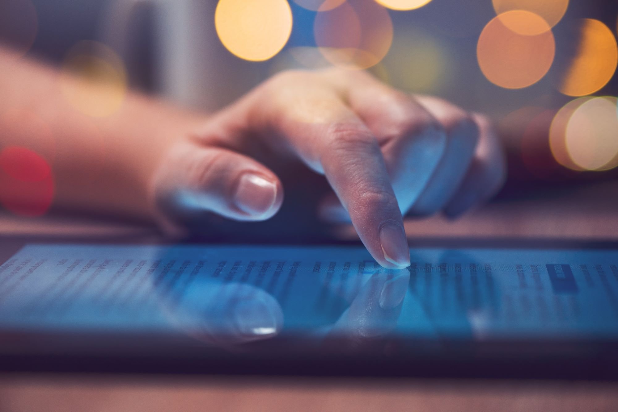 a hand and a finger, someone using a tablet