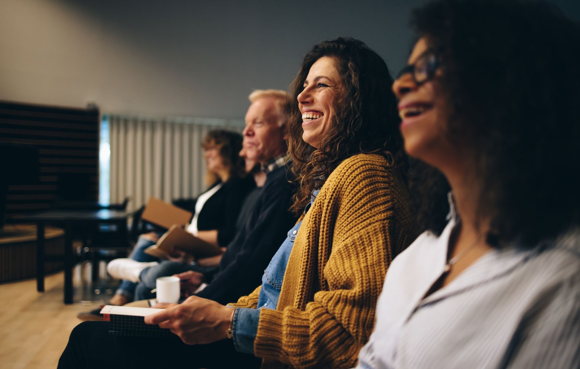 People laughing in a meeting